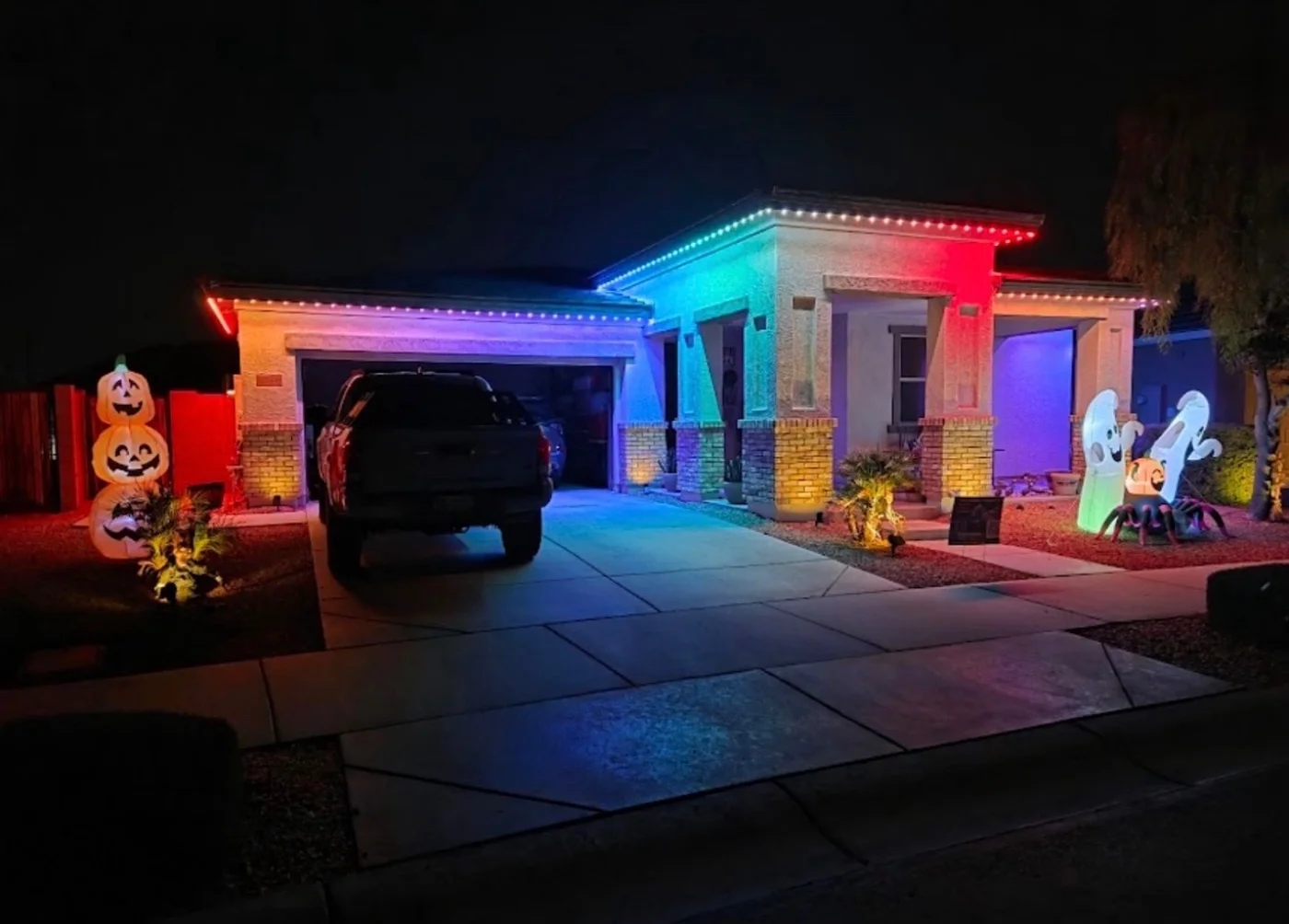 Home in multi color permanent lighting with Halloween decorations
